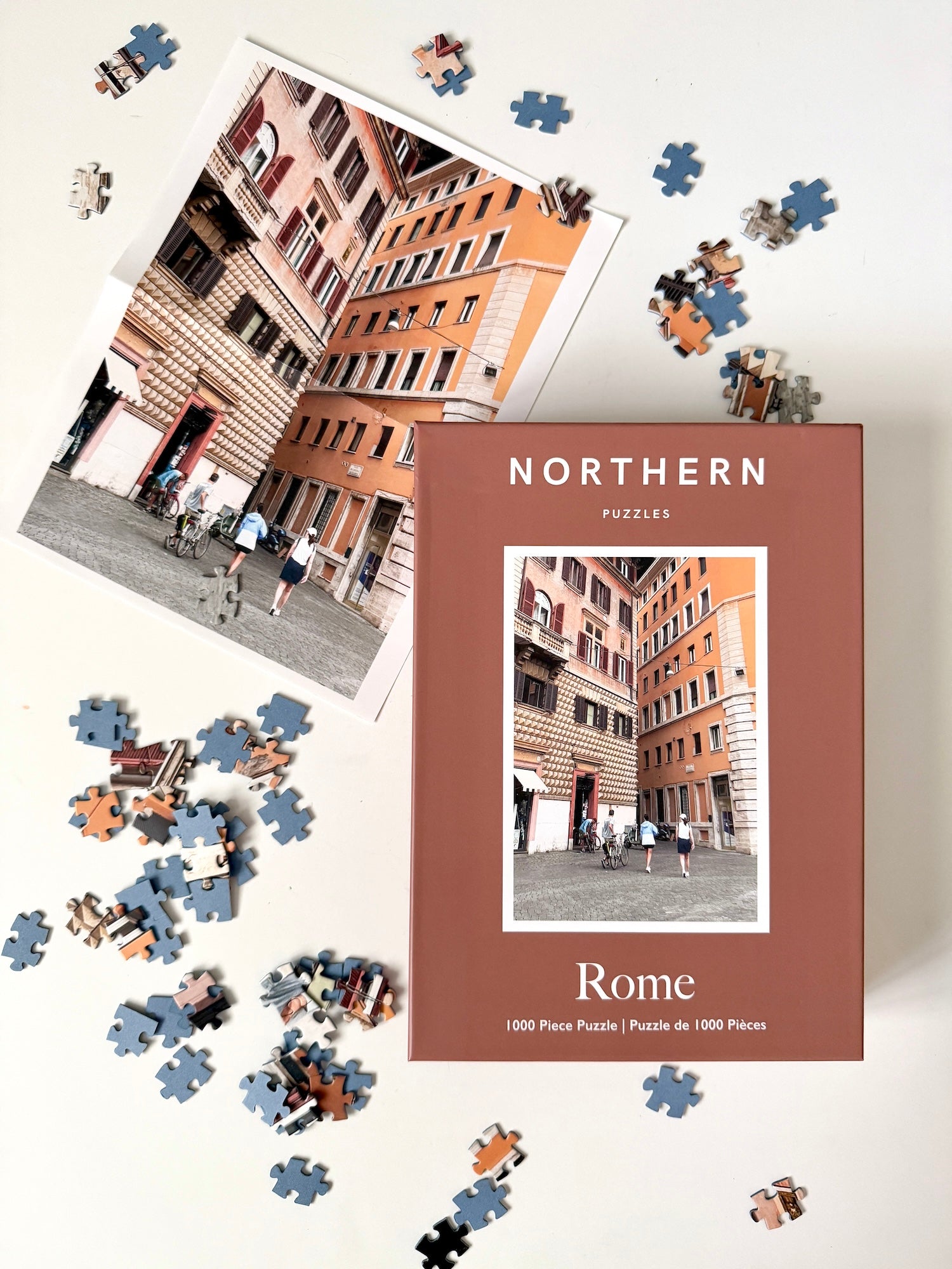 Jigsaw puzzle with pieces scattered around the box labeled 'Northern Puzzles Rome'.
