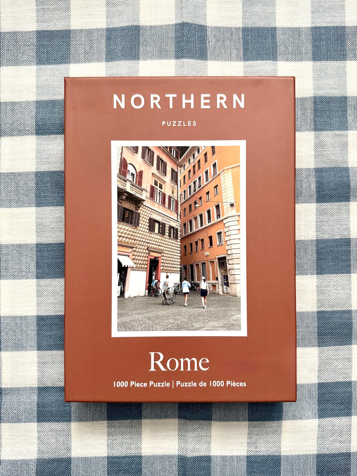 Puzzle box titled 'Rome' by Northern Puzzles on a checkered fabric background